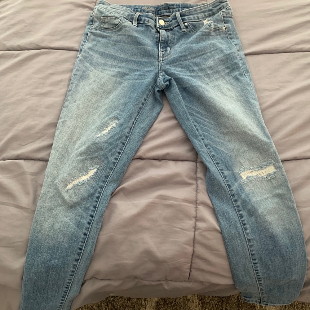 Mid-rise slightly distressed denim jeggings